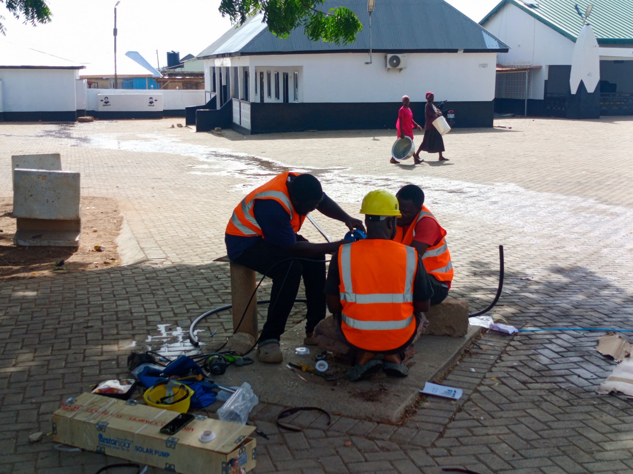 Technicians carrying out solar borehole work